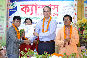 President of REHAB, Mukarram Hussain Khan, gives Certificates to the Trainees of Free Computer Training (Batch 128) as Chief Guest; Dr. M Helal is presiding over. (2014)